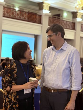 EAAMO ED & AVP of Data Science at Makerspace - facing each other